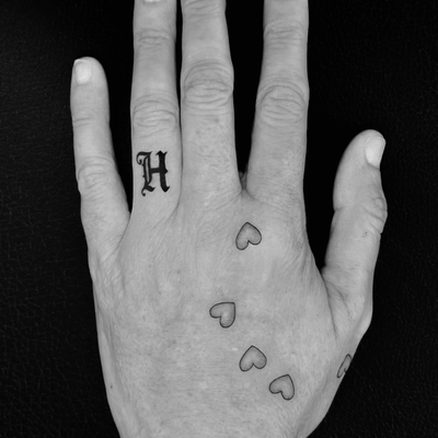 an H for her husband of 30+ years and little hearts showing where her daughter’s… — tattoo by Ariane  McDonald, Los Angeles, California