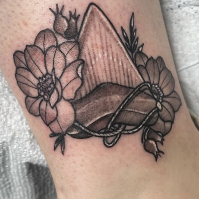 shark tooth with flowers black and grey. Done at Pretty Things PVD
For consultat… — tattoo by Corinne Clapper, Providence, Rhode Island