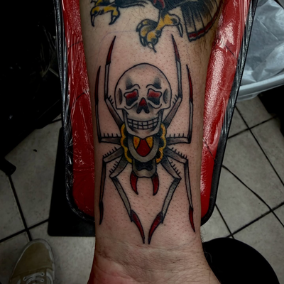 Skull spider from the other day, ALSO check out this healed and hairy eagle tatt… — tattoo by Paulie Smith, Fairless Hills, Pennsylvania