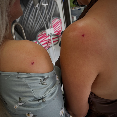 Cute small heart friendship tattoo 
Covering up a lil freckle — tattoo by Jc TheArtist, Downey, California