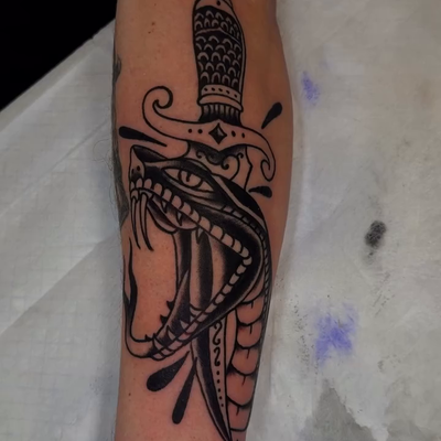 Blackwork traditional snake and dagger tattoo for my new friend, Rowdy.  Thanks … — tattoo by Josh Hall, Dallas, Texas