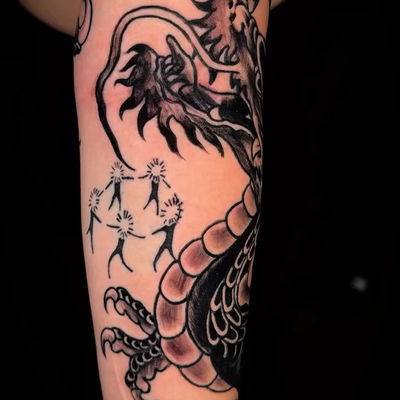 Large blackwork dragon added into an in‑progress sleeve – my part is the dragon … — tattoo by Josh Hall, Dallas, Texas