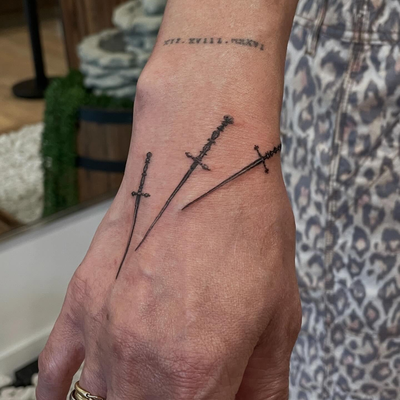 Custom micro sword design 
🗡️ 🗡️🗡️
DM to book a session 
📍109 N La Cienega B… — tattoo by Raivo Broks, Beverly Hills, California