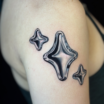 Loved doing these chrome stars — tattoo by Morgan Penton, Dallas, Texas
