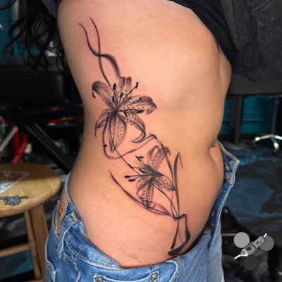 Paintbrush style dainty floral cover-up. Turning a negative memory into a beauti… — tattoo by Luis Belloso, Whittier, California