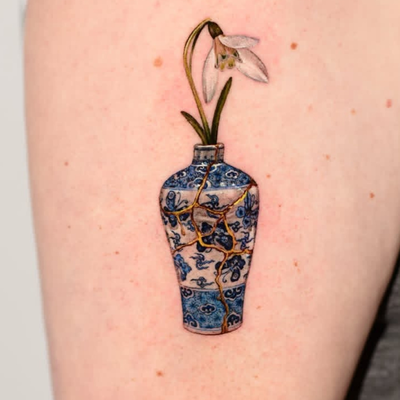 little snowdrop in pircalain vase Ive done — tattoo by Sagdiana  Kashaeva, Boston, Massachusetts