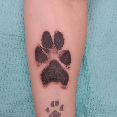 #pawprints #pawprintstattoo — tattoo by Jim  Lyons, Portsmouth, Rhode Island