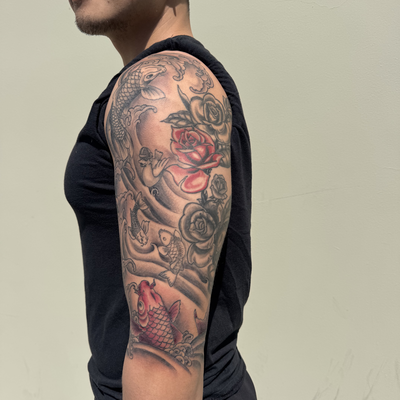 Japanese inspired sleeve progress featuring koi, roses, waves, and black & gray … — tattoo by Jessica Hurteau, Newport Beach, California