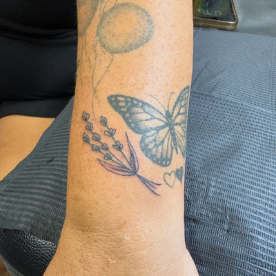 Added this little sprig of lavender alongside her existing butterfly 🪻🦋

I lov… — tattoo by Jessica Hurteau, Newport Beach, California