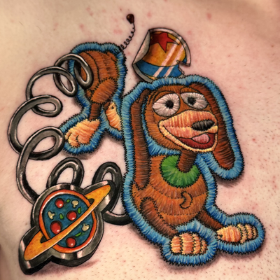 Slinky! 🐶✨ One of my absolute favourite Disney Pixar characters, and I was SO e… — tattoo by Pinkat Tattoo, Scarborough, WA