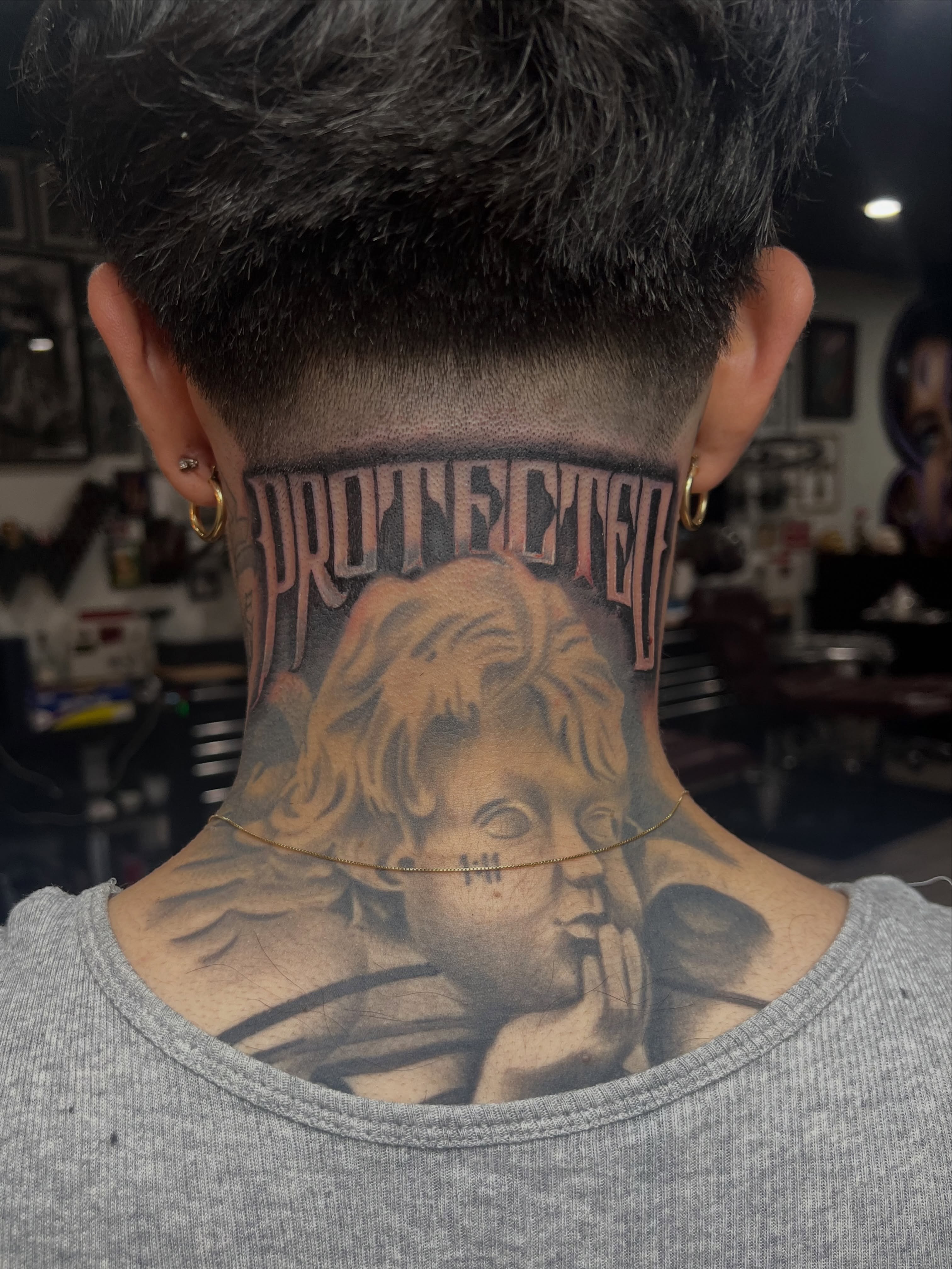 “PROTECTED” done on the homie Diego. Cherub not done by me. I had to work with e… — tattoo by Quan G, Union City, California
