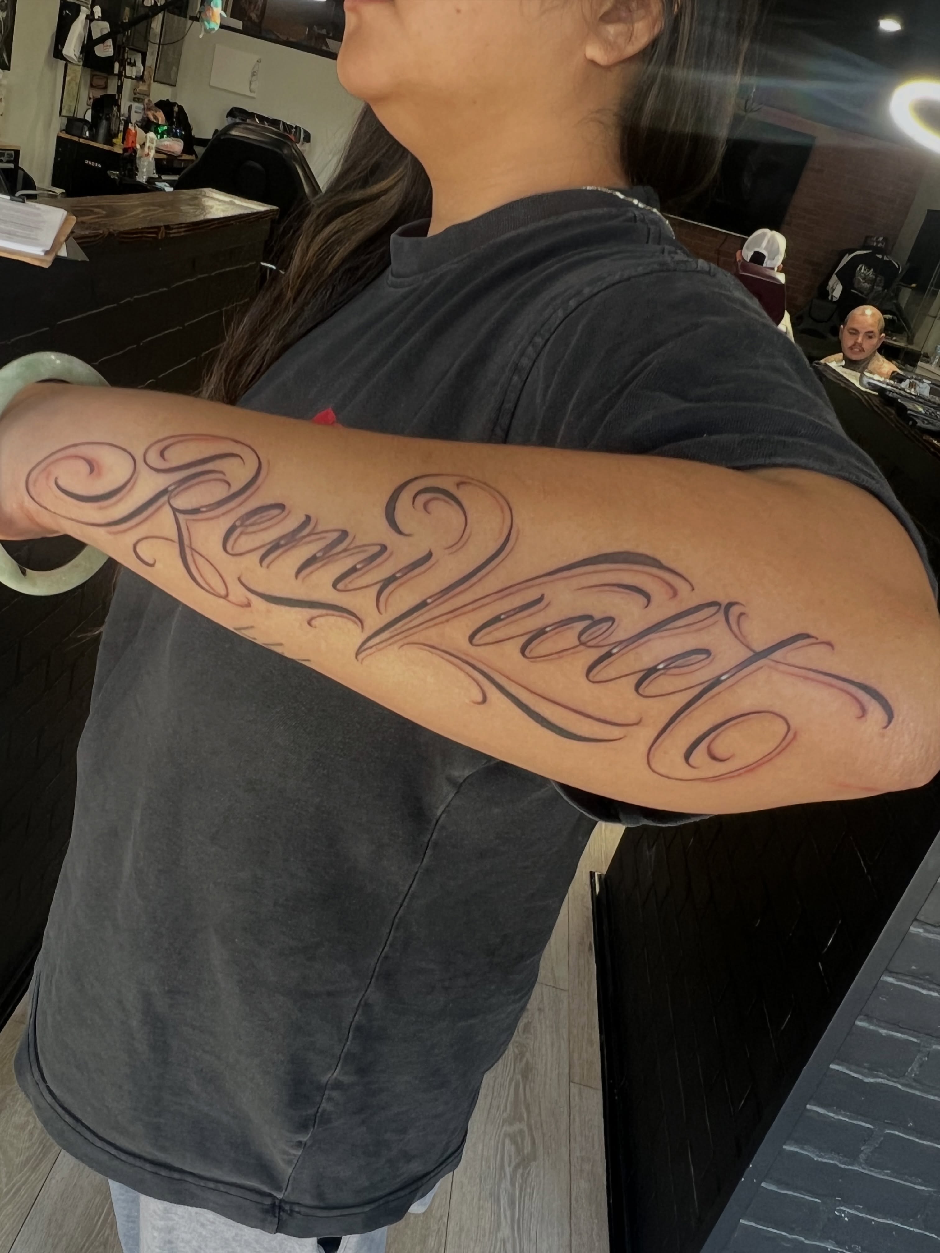 “Remi Violet” script on the forearm for @hivykd . More of this please!!!!

#Shar… — tattoo by Quan G, Union City, California