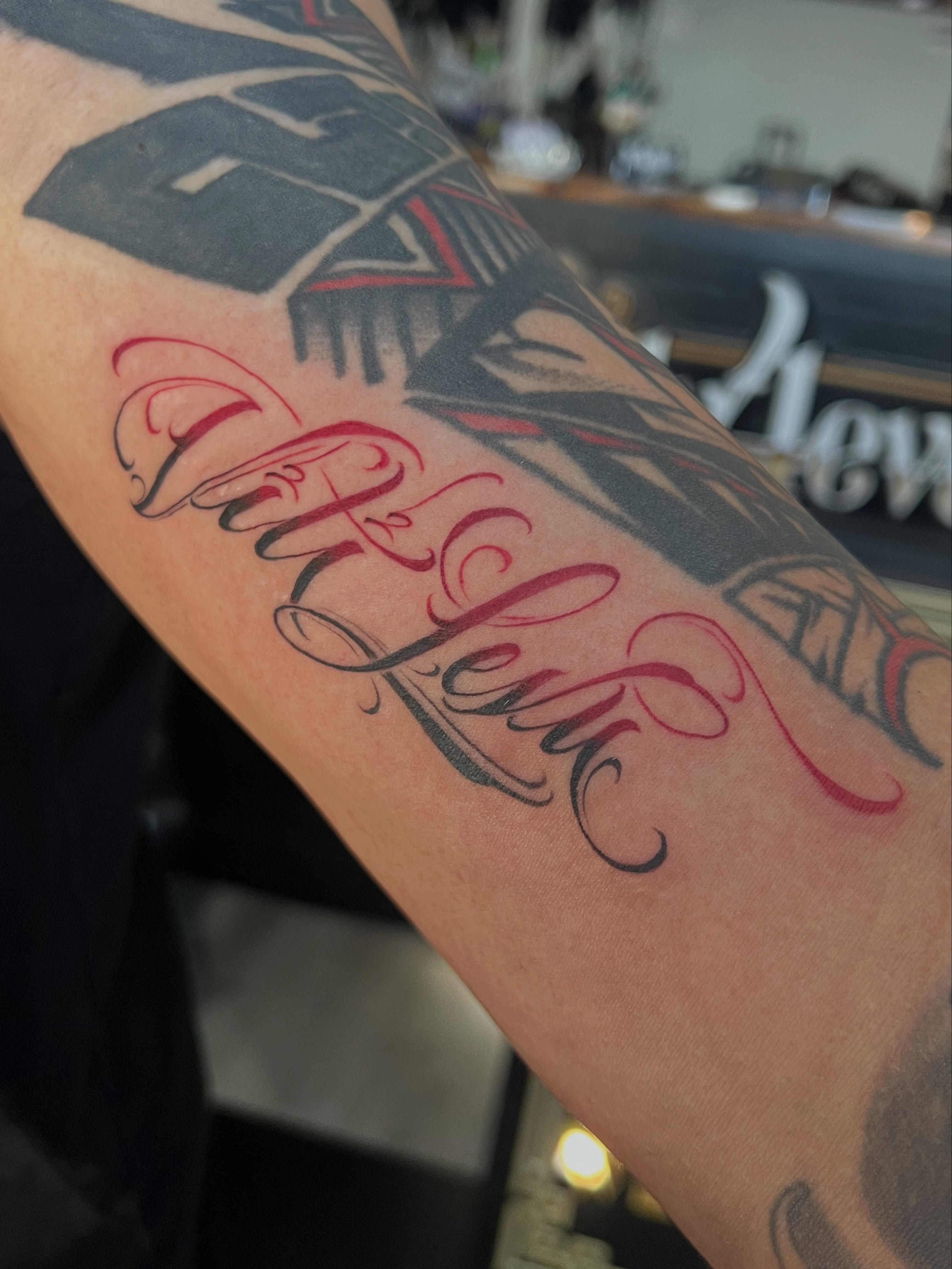 “Viti Levu” ombré red to black script on @xxajreigns86xx 

#SharkTank2 #QuanG #b… — tattoo by Quan G, Union City, California