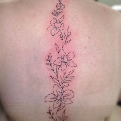 Fine line larkspur flower spine piece. More flowers please! 

#flowertattoo
#fin… — tattoo by Kyle Soden, Honesdale, PA