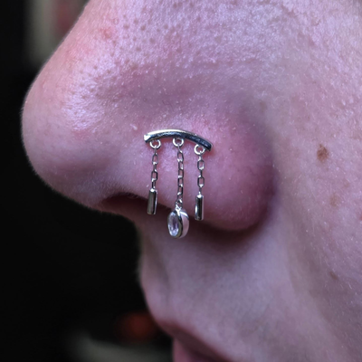 Beautiful jewelry upgrade for this nostril piercing featuring the 14k Dwiggi end… — tattoo by Kyle Soden, Honesdale, PA