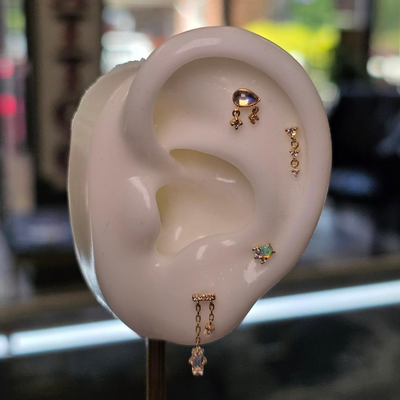 A stunning Modern Mood jewelry ear curation 😍 I am in love with all these piece… — tattoo by Kyle Soden, Honesdale, PA