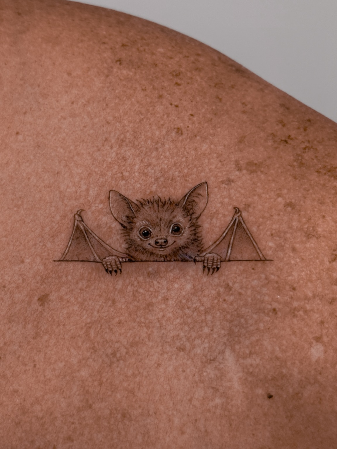 The cutest little scar cover-up 🦇🤍 Who knew a tiny bat could be this adorable?… — tattoo by Agnė Kastanauskaitė, Los Angeles, California