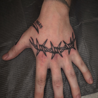 barb wire knucks at branded tattoo co — tattoo by Brett Ferguson, Nashville, Tennessee