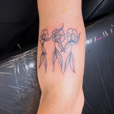 Who wouldn’t want dancing flowers? JS — tattoo by Sarah Corley, Jefferson, Georgia