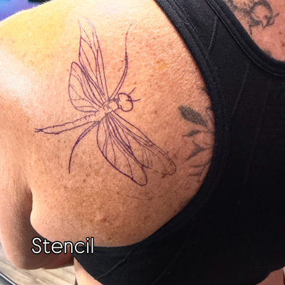 The sweetest lil dragonfly from my flash to fill in space with this large back p… — tattoo by Sarah Corley, Jefferson, Georgia