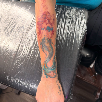 Mermaid down, whole world still to build. Next we will do a jellyfish. 🪼 I’m so… — tattoo by Sarah Corley, Jefferson, Georgia