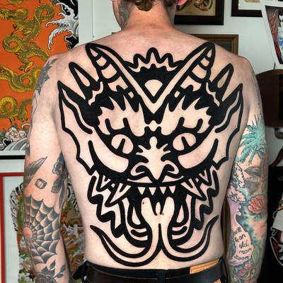 Bold demon backpiece outline — tattoo by Jitan Forcier