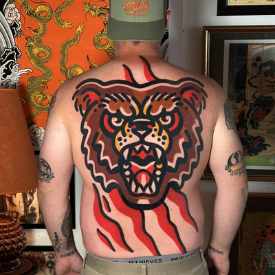 Bold bear backpiece tattoo — tattoo by Jitan Forcier