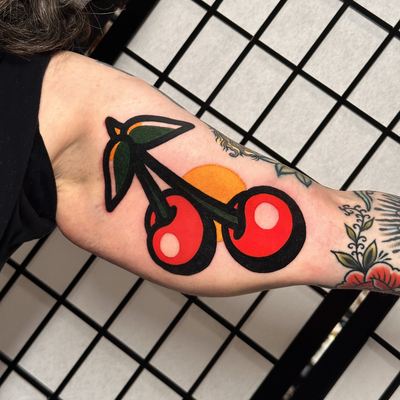 inner bicep cherry tattoo
Modern bold — tattoo by Jitan Forcier