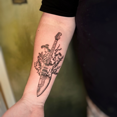 considering its CMA weekend here’s a super fun guitar / chefs knife tattoo trans… — tattoo by Natasha Rachel, Nashville, Tennessee