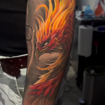 Rebirth in Ink – Phoenix Power I continued with some background to tie existing … — tattoo by Albert Rosal, Harrison, New Jersey