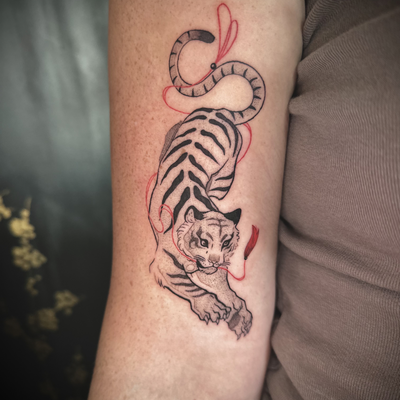 I’ve been loving adding these little pops of red to my black and grey pieces! 🩸 — tattoo by Cece Rodriguez
