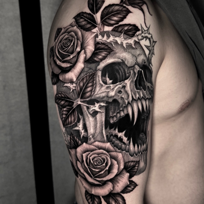 First tattoo for Treyson.  You can’t go wrong with a skull and roses 🌹. Some he… — tattoo by Ryley  Smith, Bozeman, Montana