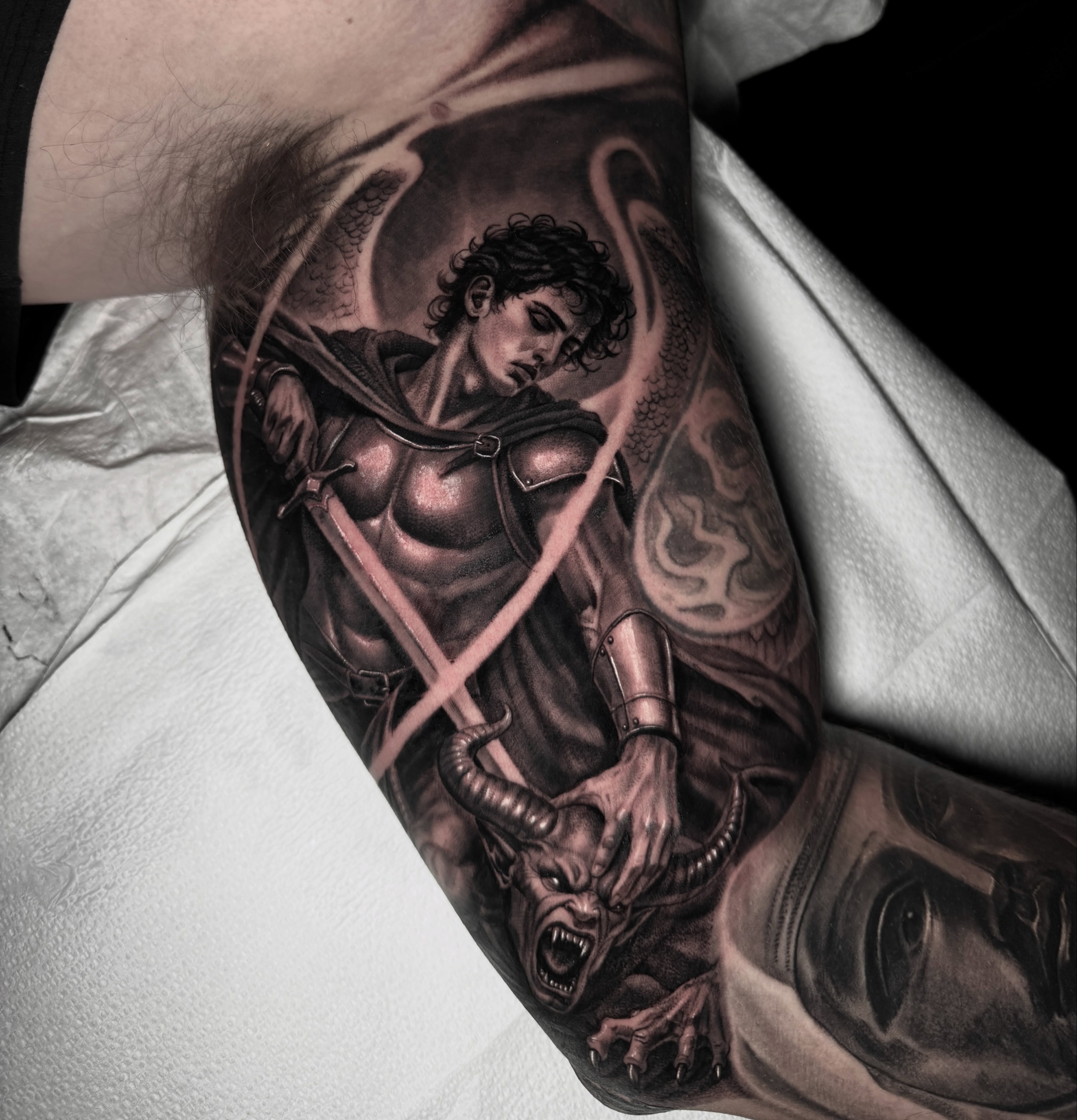 One of the most technical tattoos I’ve done in a while.  Tiny faces and tiny han… — tattoo by Ryley  Smith, Bozeman, Montana