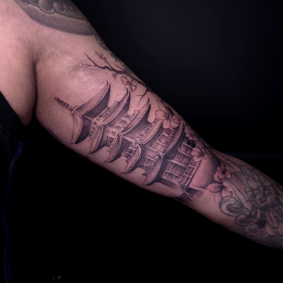 Japanese pagoda for the inner bicep — tattoo by Avinash Samaroo, Queens , New York